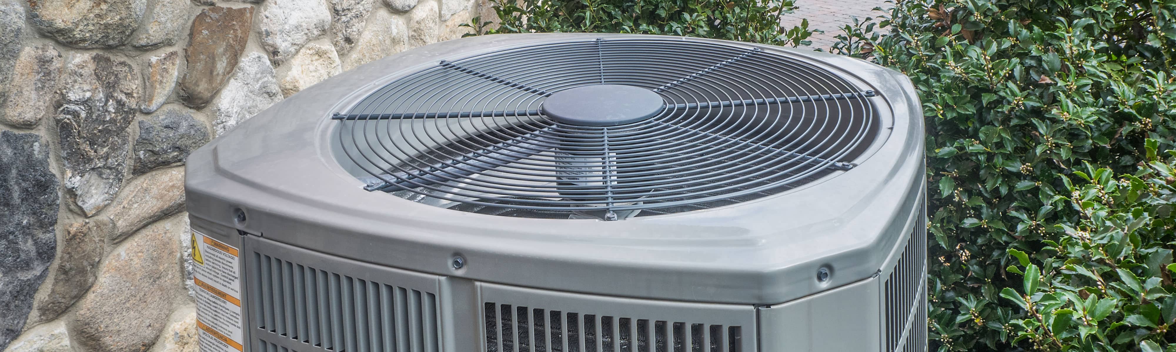 Close up of an outdoor air conditioner.