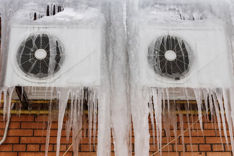 Air Conditioning unit with ice frozen on it.
