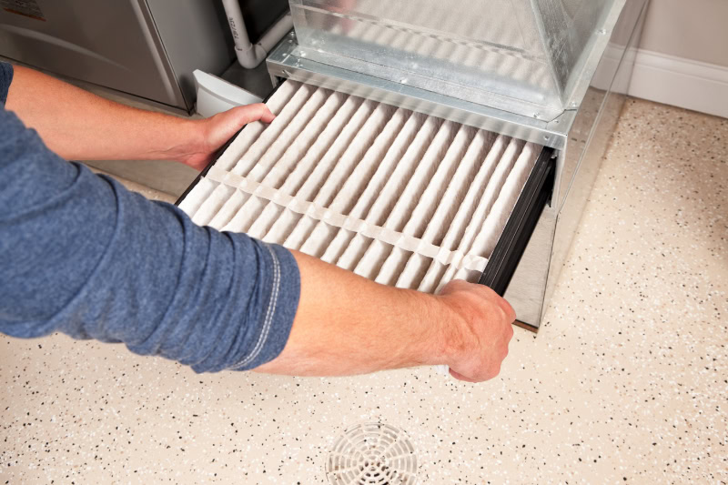 Technician replacing filter.