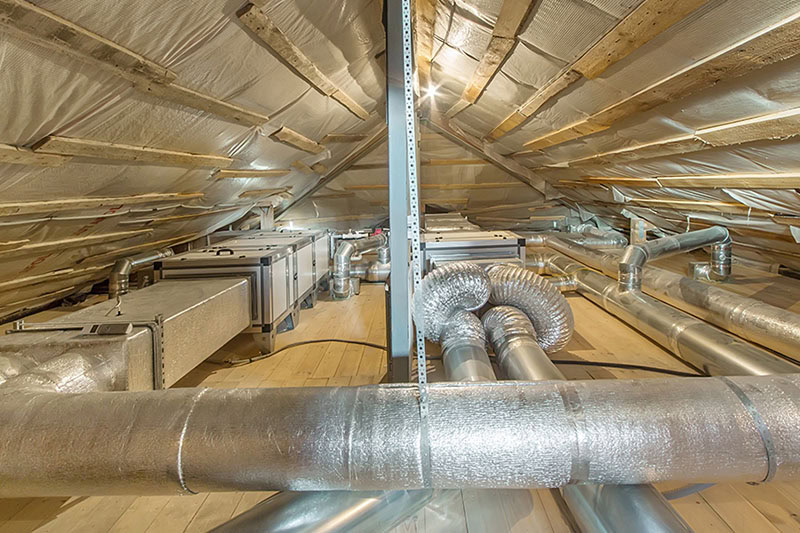 An attic with air ducts.